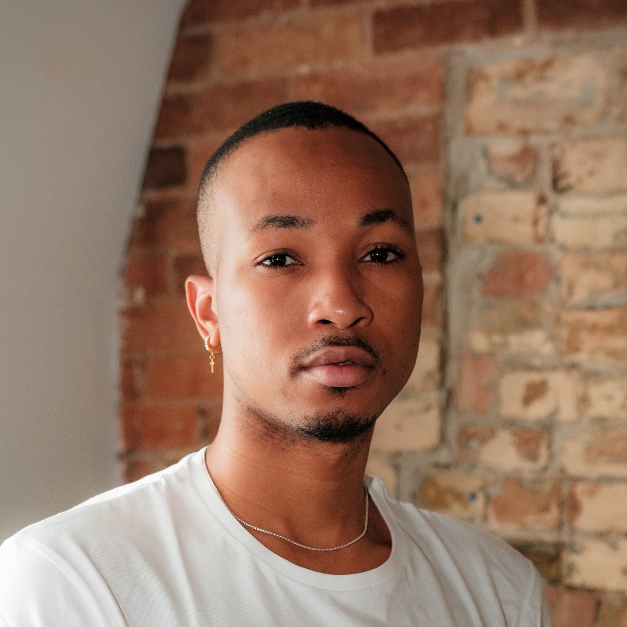 files/person-in-a-white-shirt-looks-at-the-camera.jpg